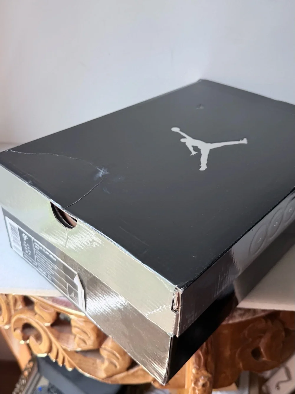 Nike Jordan Team Reign Low sneakers in a white, black, and red colorway,